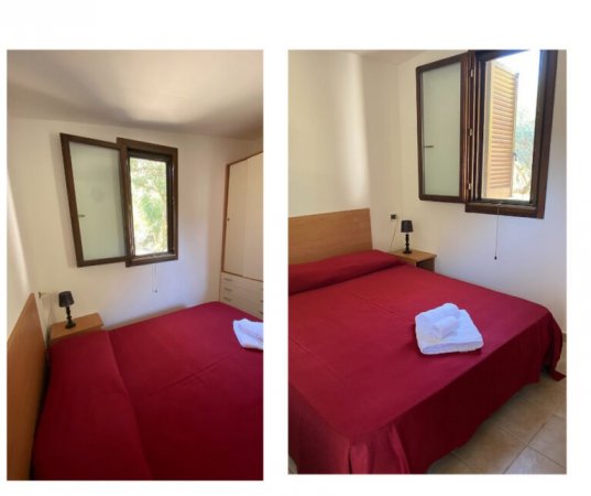 Camera con letto matrimoniale e finestra.