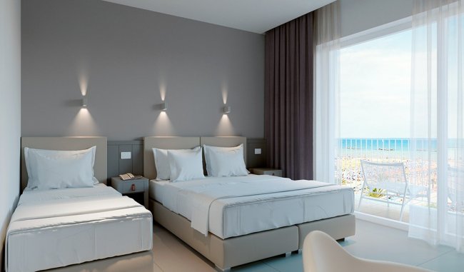Camera d'hotel moderna con due letti e vista mare.